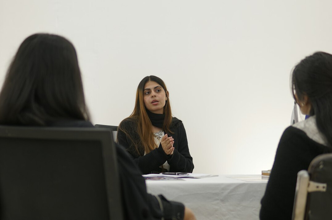 person speaking confidently in meeting