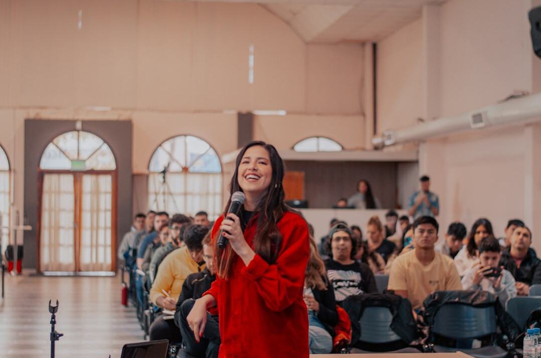 woman presenting to audience