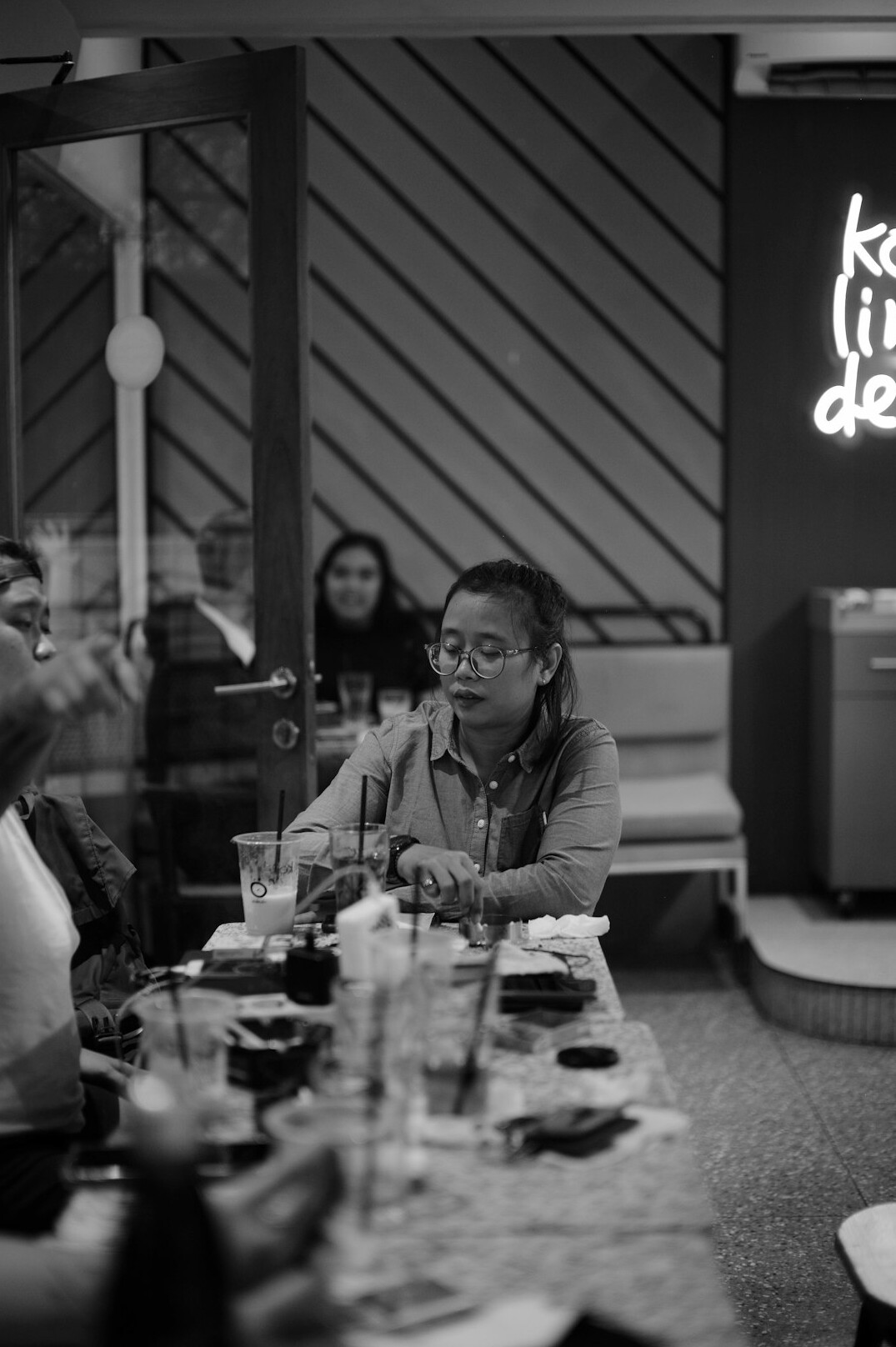 Small group of people discussing ideas around a table
