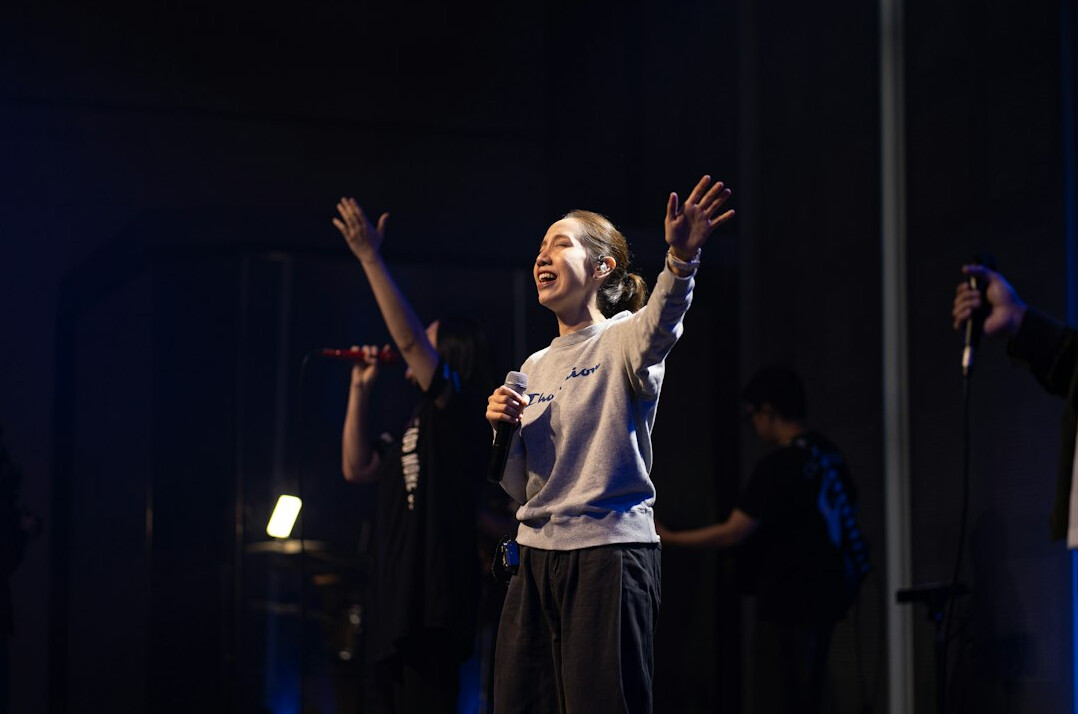 confident person smiling on stage