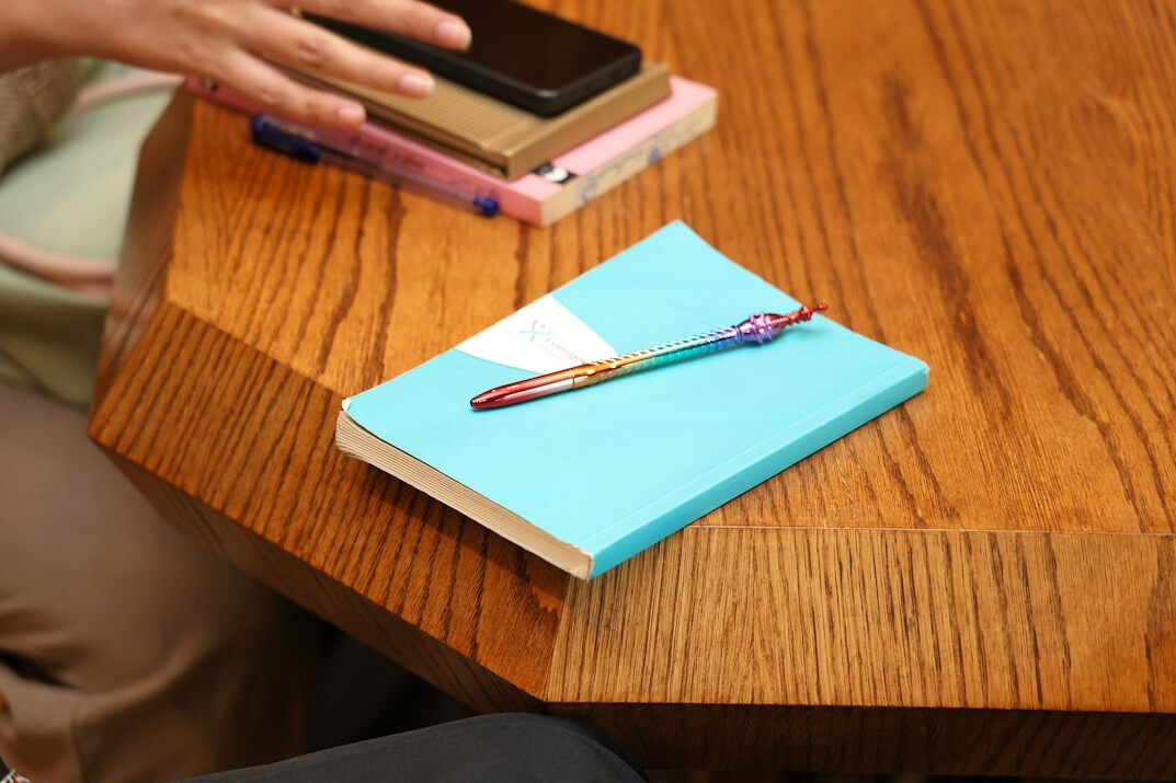 person journaling at desk